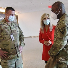 Medical reporter Liz Bonis from WKRC-TV speaks with Ohio National Guard members in The Christ Hospital lobby