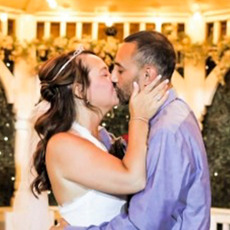 Aaron Perez and his wife Chastity share a kiss on their wedding day
