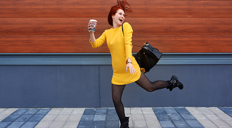 Woman on the go with coffee