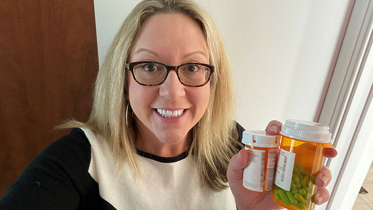 Q102's Jennifer Fritsch holds up several prescription medications