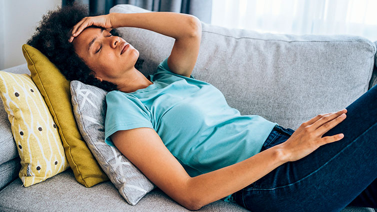 Woman resting on couch