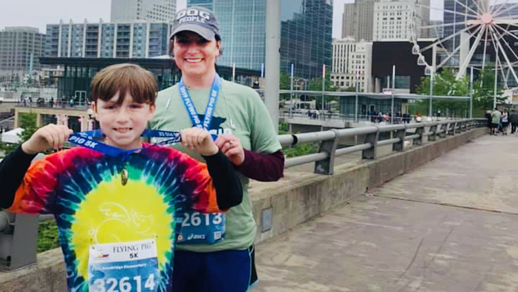 B105 radio personality Chelsie and her son after completing the Flying Pig Marathon relay.