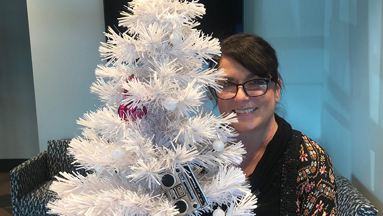 B105 radio personality, Chelsie, with a white Christmas tree, for her blog about holiday depression.