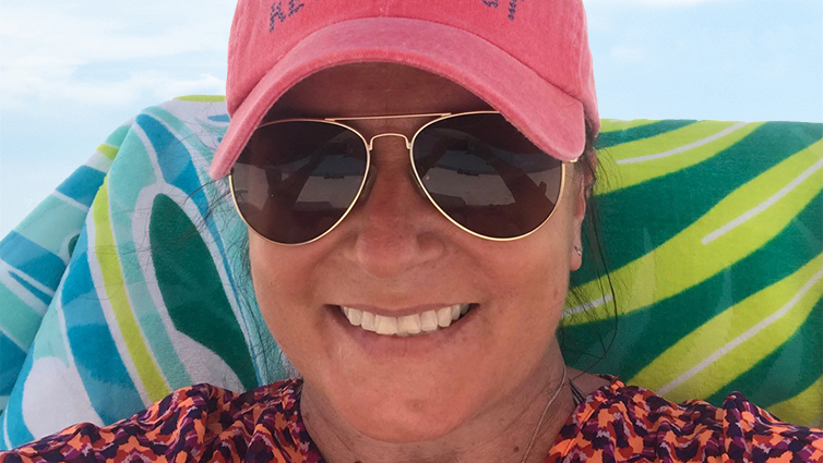 B105 radio personality Chelsie wearing sunglasses at the beach for her blog on skin cancer with The Christ Hospital.