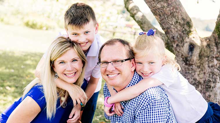 Christine Chadwell, APRN, and her family outdoors.