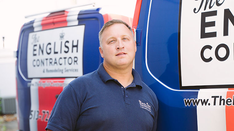 HGTV's English contractor Craig Russell wears a blue polo and stands in front of his truck, for a blog about an ortho injury.