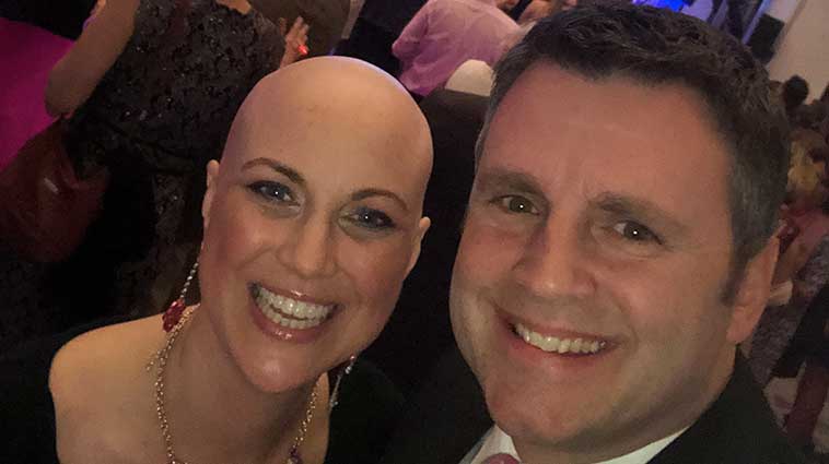 Katie Marshall, a breast cancer survivor and Christ Hospital patient, and her husband, at a benefit event. 