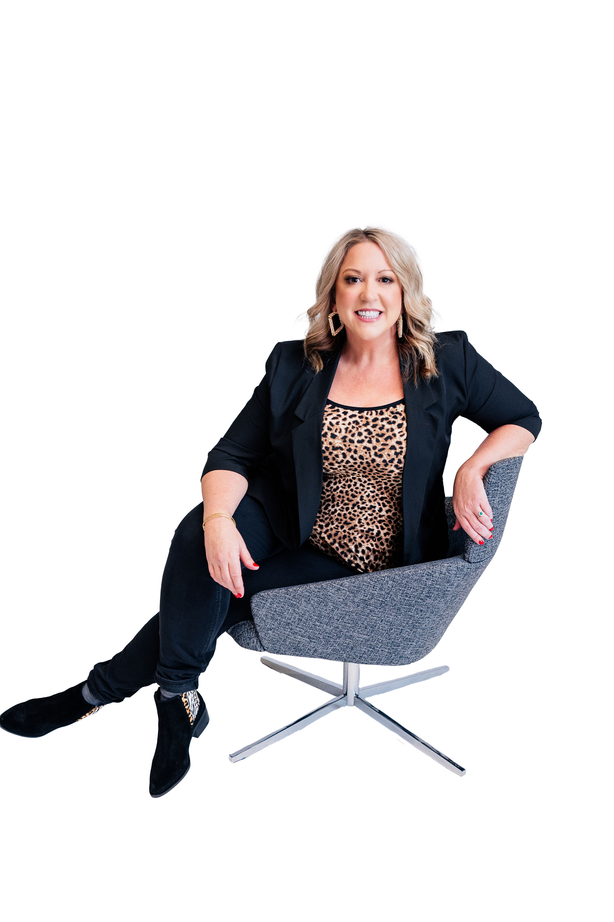 Q102 radio personality Jennifer Fritsch, dressed up and seated in a chair, for her blogs with Healthspirations.