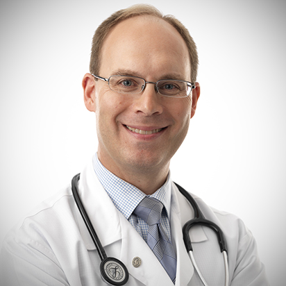 Thomas Lamarre, MD, infectious diseases, wearing a white lab coat.