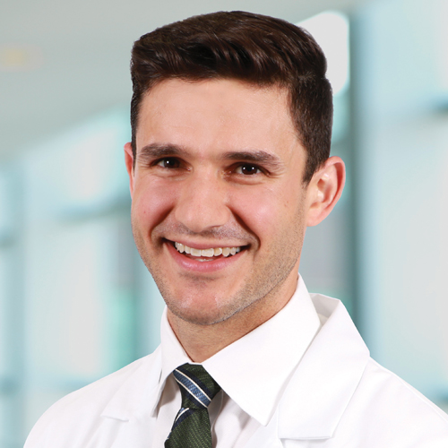 Ryan Seal, MD, spine surgeon at The Christ Hospital, wearing a white lab coat.