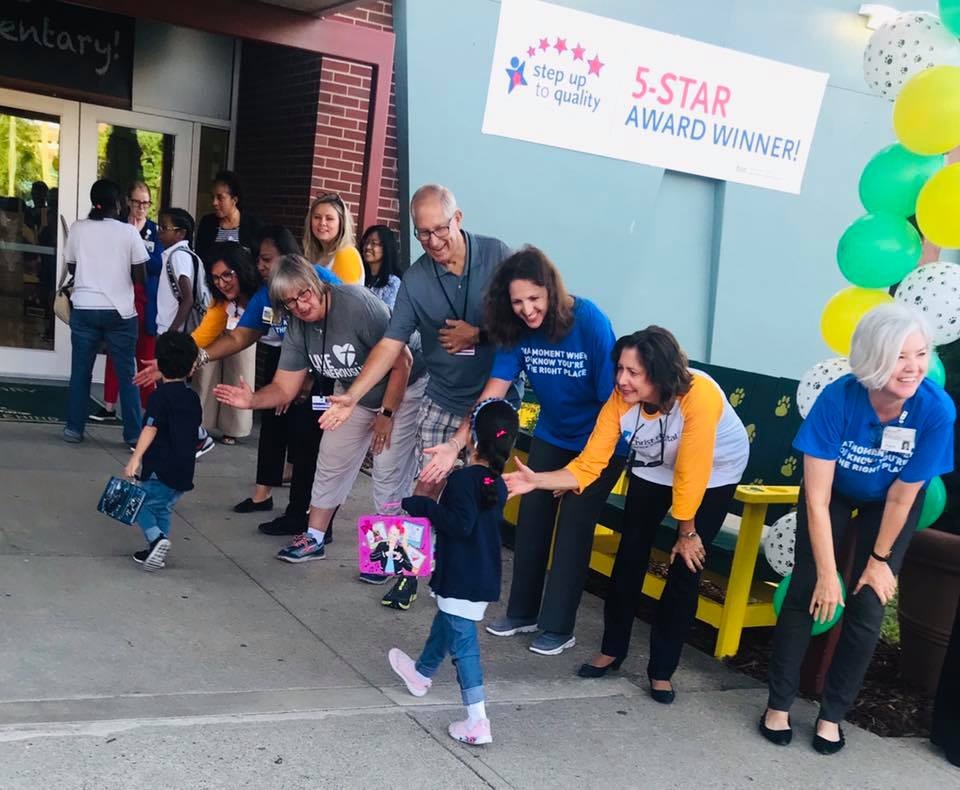The Christ Hospital employees welcoming Taft Elementary students back to school