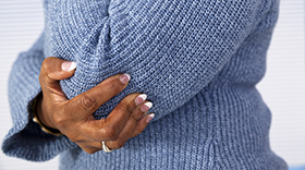 African american woman with elbow arthritis