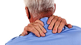 Older man massaging neck