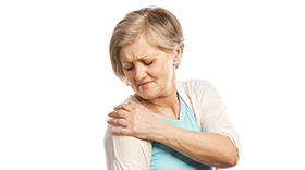 Woman with pain in shoulder