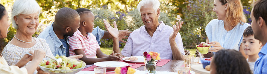 Happy family with older gentleman recovering from neurosurgery at The Christ Hospital. 