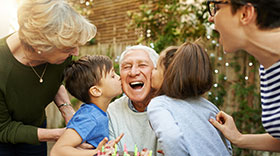 Older man at party after recovering from hemorrhage at The Christ Hospital. 