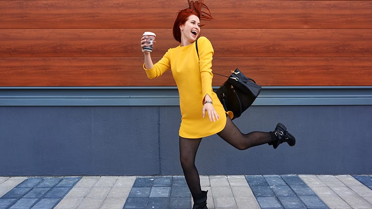 Woman on the go with coffee