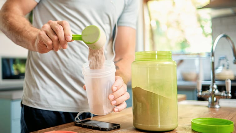 Person mixing protein shake