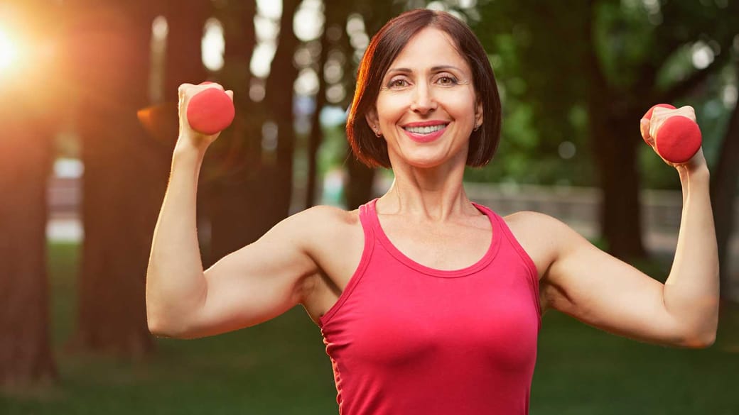 Middle aged woman exercising outdoors.