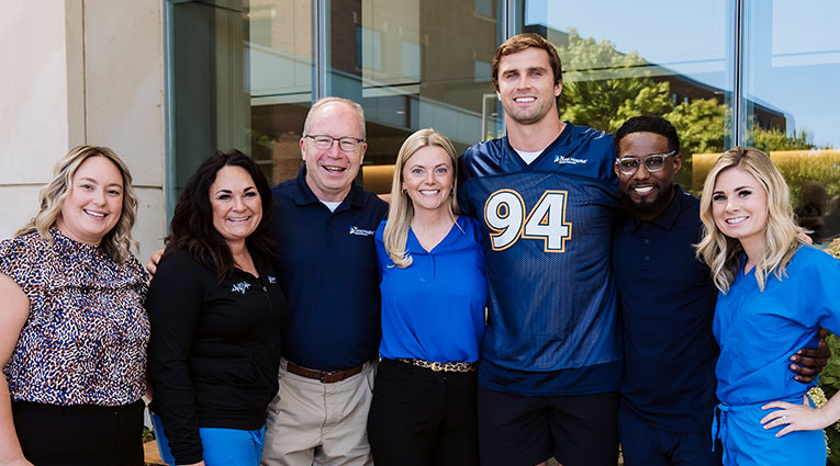 Sam Hubbard with team members from The Christ Hospital Health Network